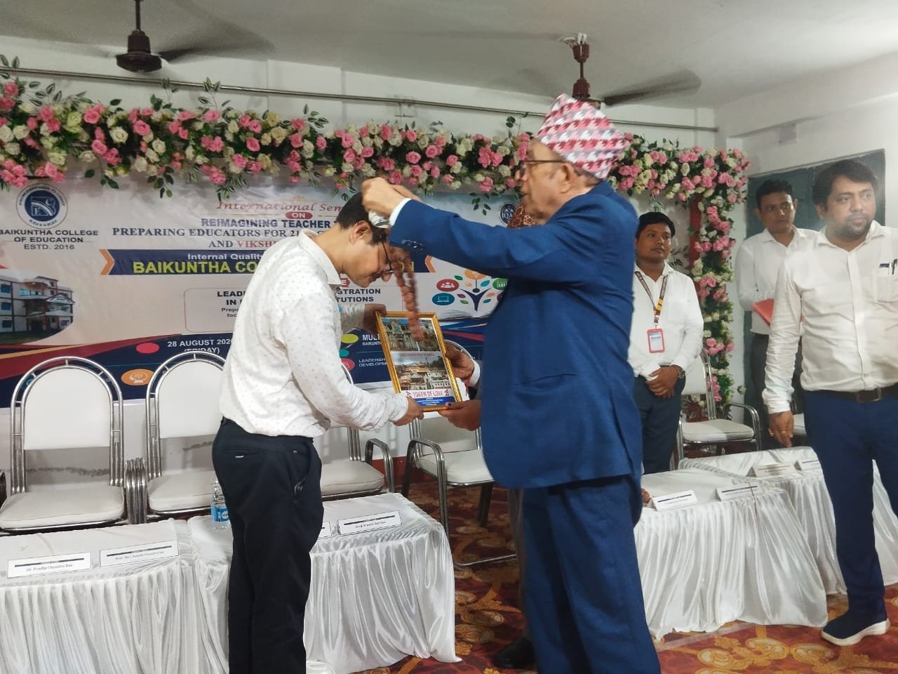 Chief Guest receiving material at Topic Engine Launching Program